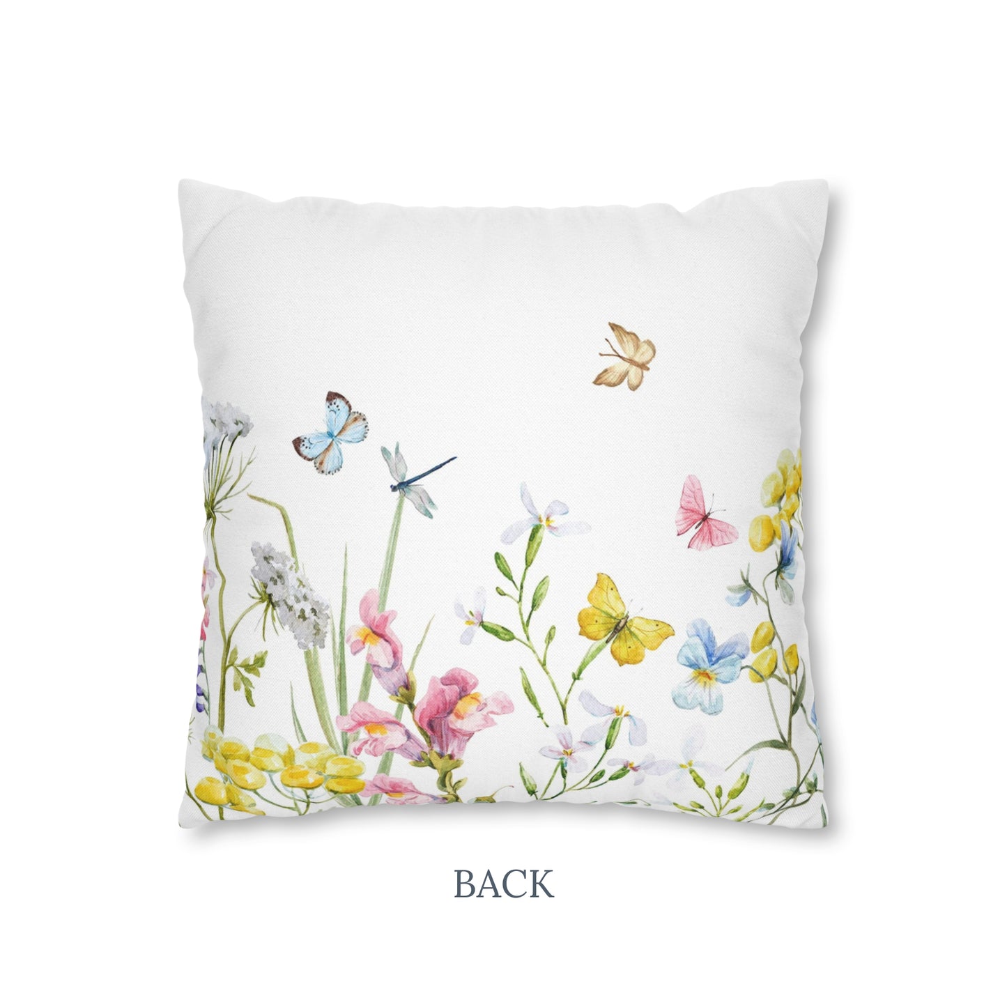 a white pillow with colorful flowers and butterflies on it