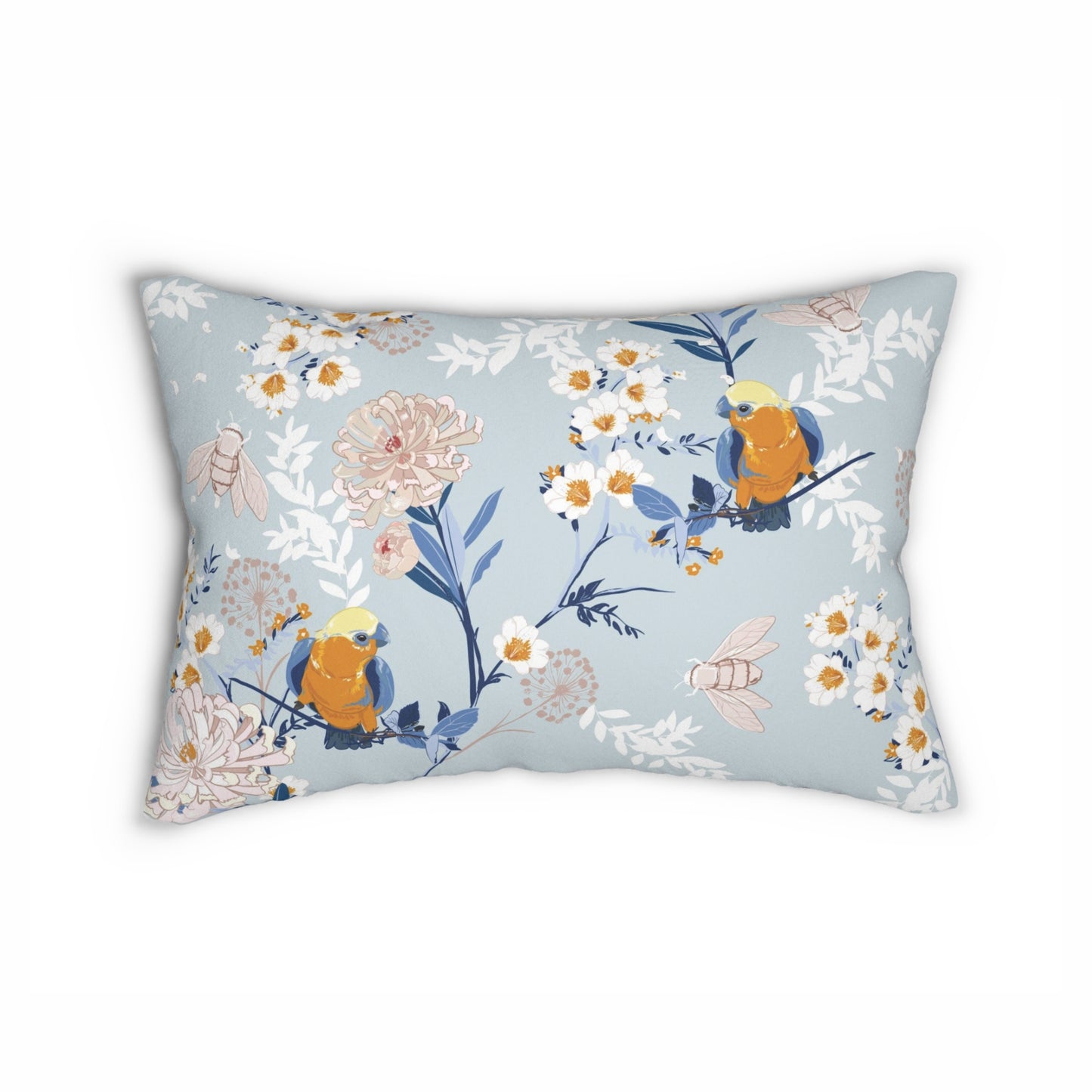 a blue pillow with a bird and flowers on it
