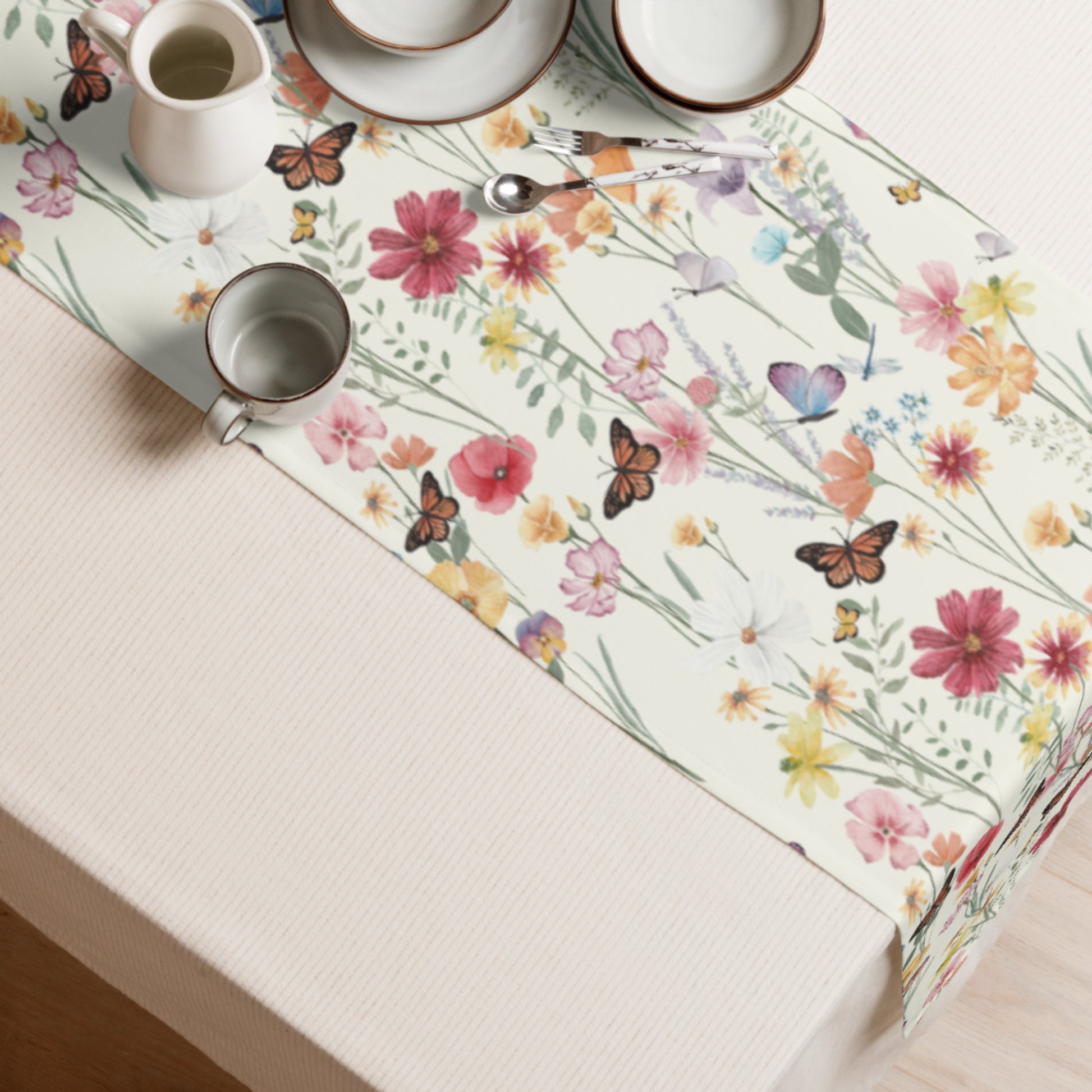 flower table runner on table with mugs and cups