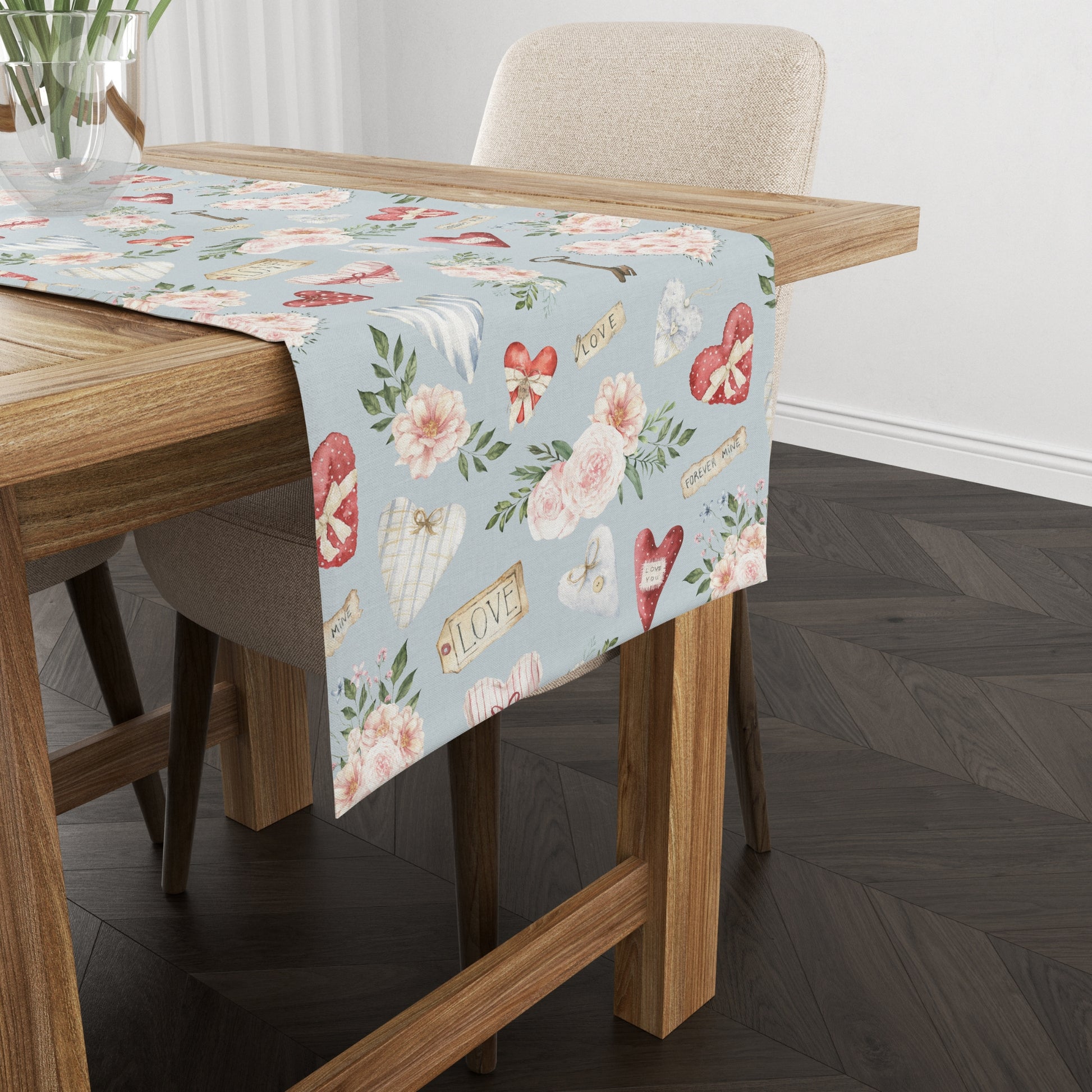 a table with a floral table runner on it