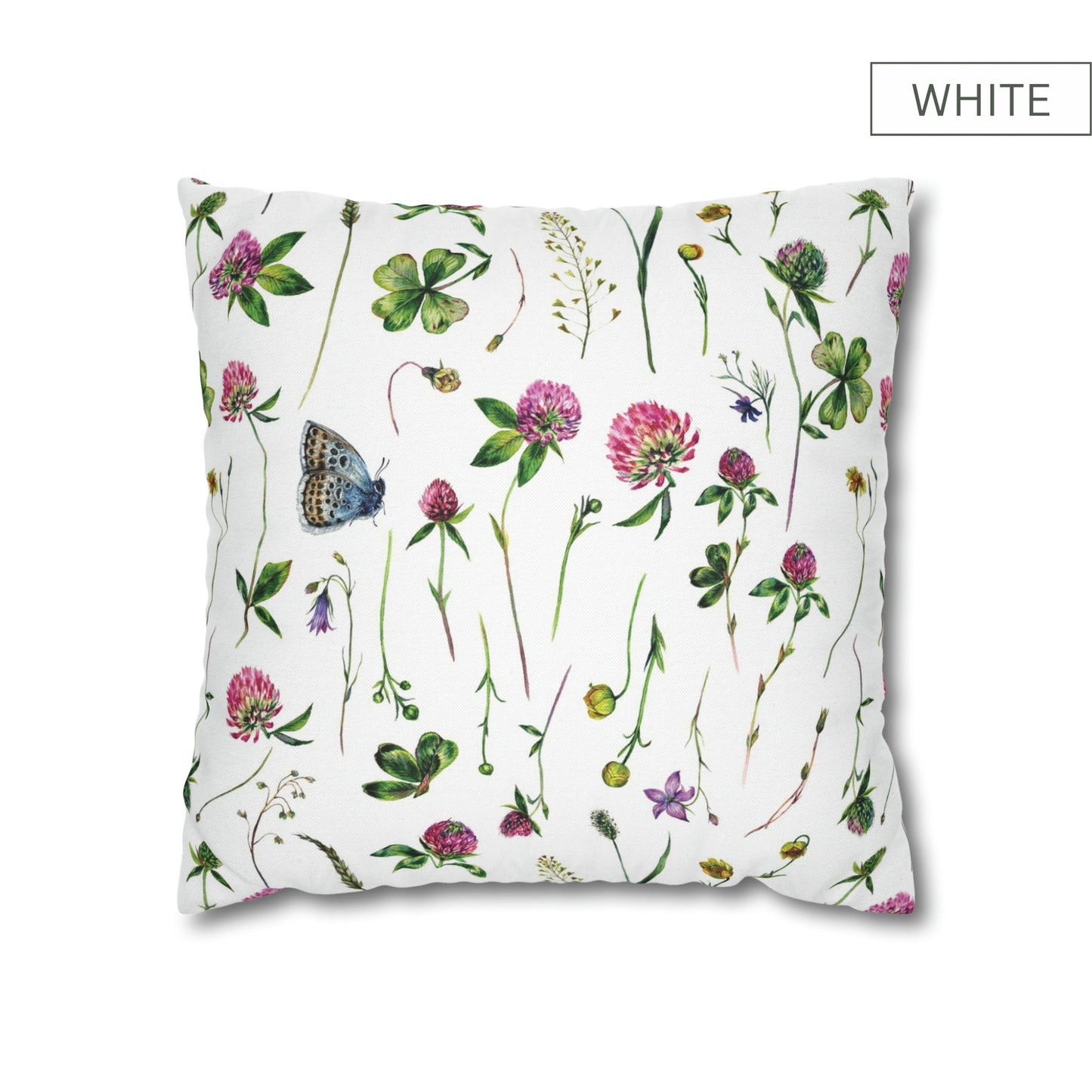 a white pillow with flowers and butterflies on it