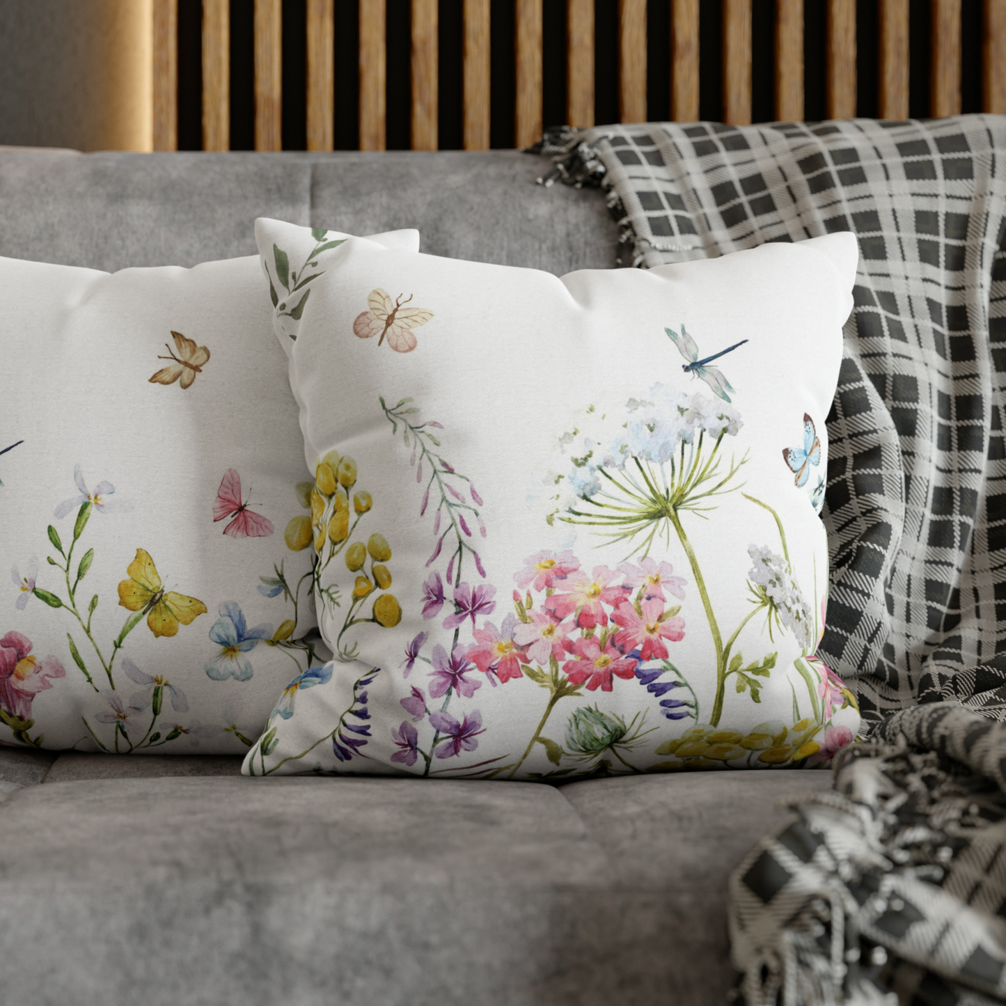 a close up of two pillows on a couch