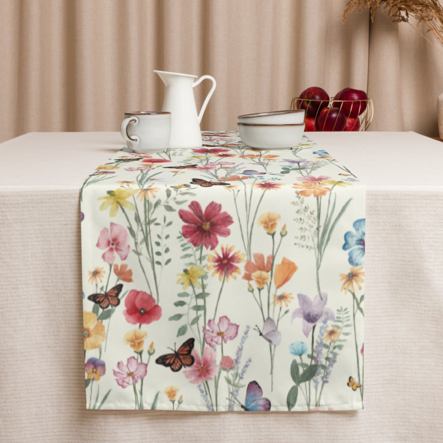 a botanical flowers table runner topped with cups and saucers on top of a table