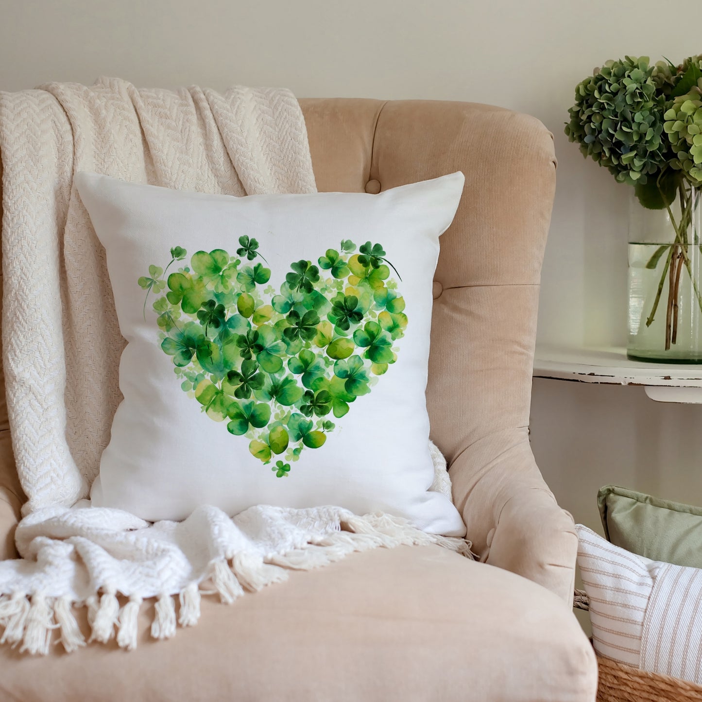 a heart made of clover leaves on a pillow on a chair
