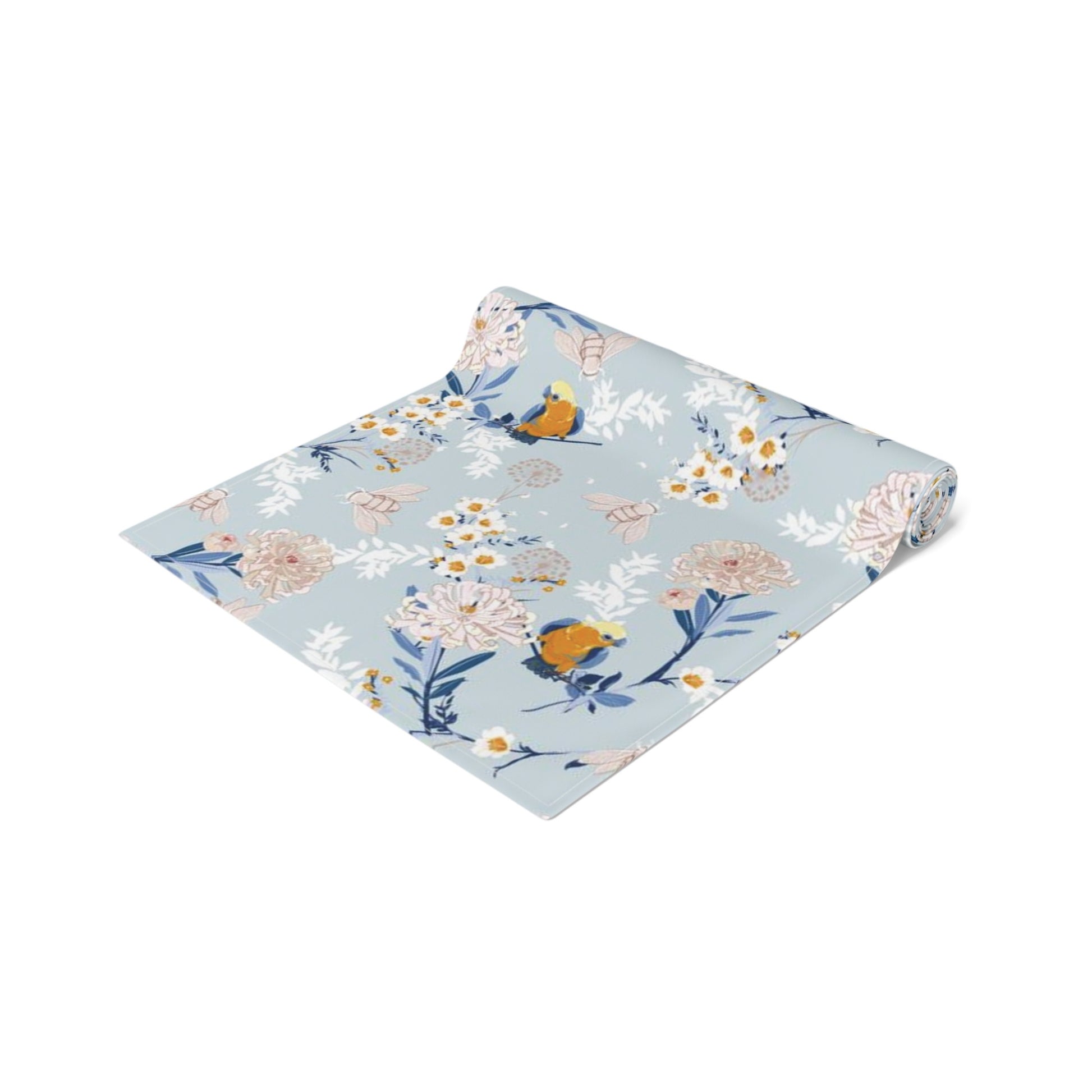 a blue and white floral napkin with a bird on it