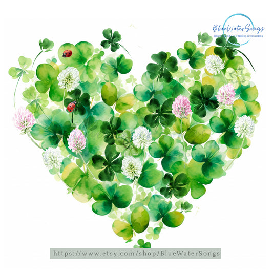 a heart shaped arrangement of clover leaves and flowers