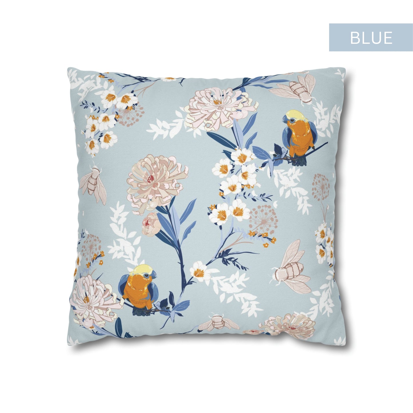 a blue pillow with flowers and birds on it