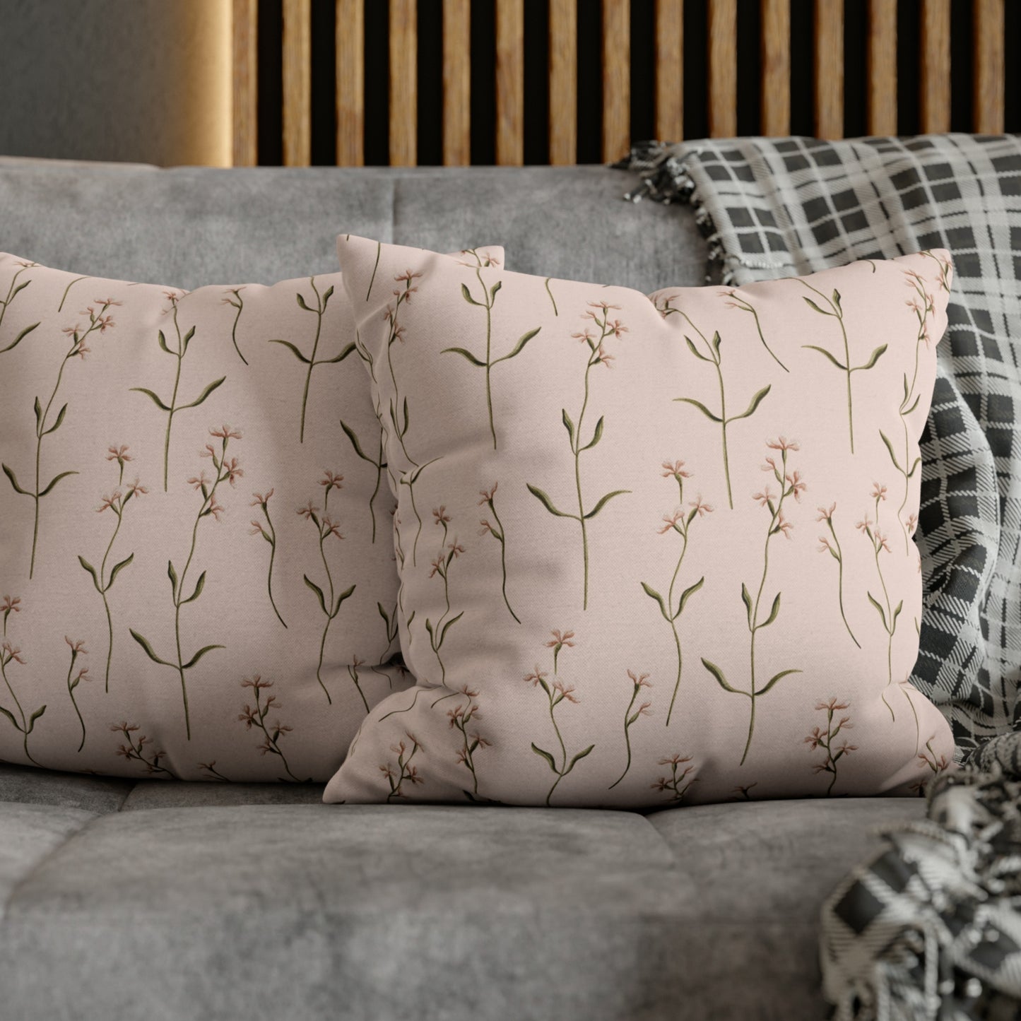 a close up of two pillows on a couch