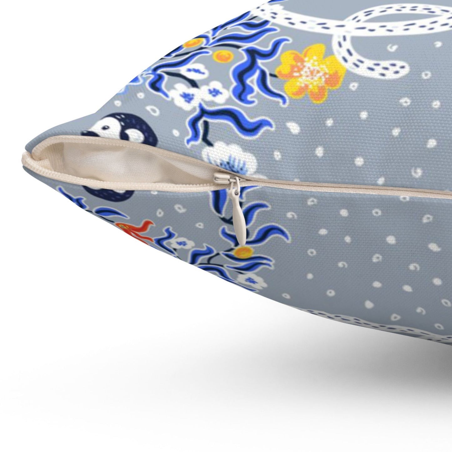 Chinoiserie pillow cover close-up with zipper. Monkey and floral design on light grey fabric.