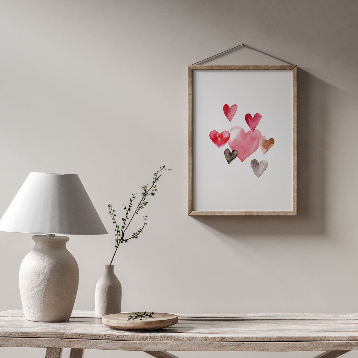 minimal living room with pink hearts valentine wall art on the wall