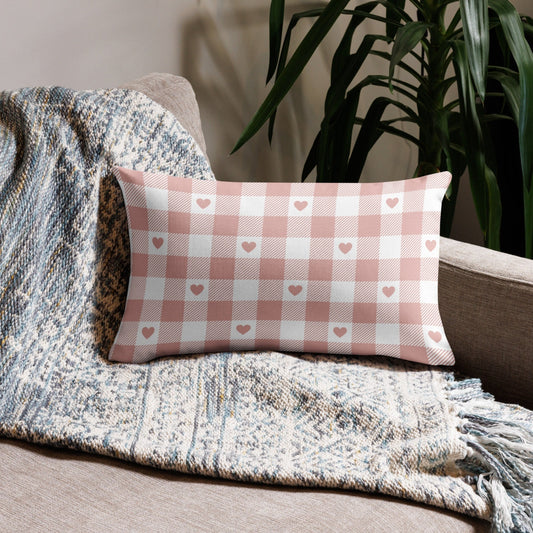 Valentine Pink Gingham Hearts PILLOW in lumbar size on a cozy sofa with textured blanket – soft romantic décor.
