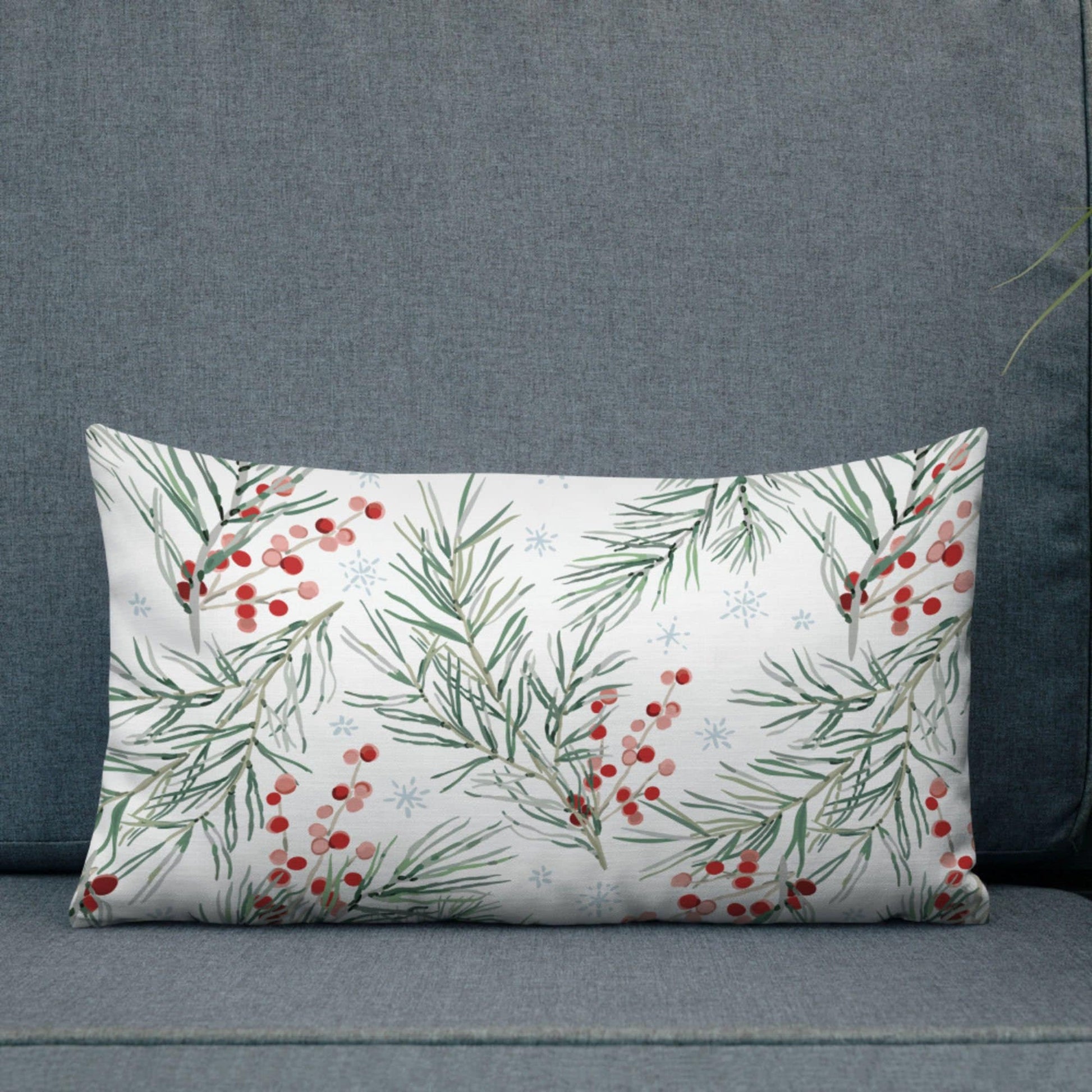 Winter Berry Botanical Christmas lumbar pillow from Blue Water Songs on grey sofa
