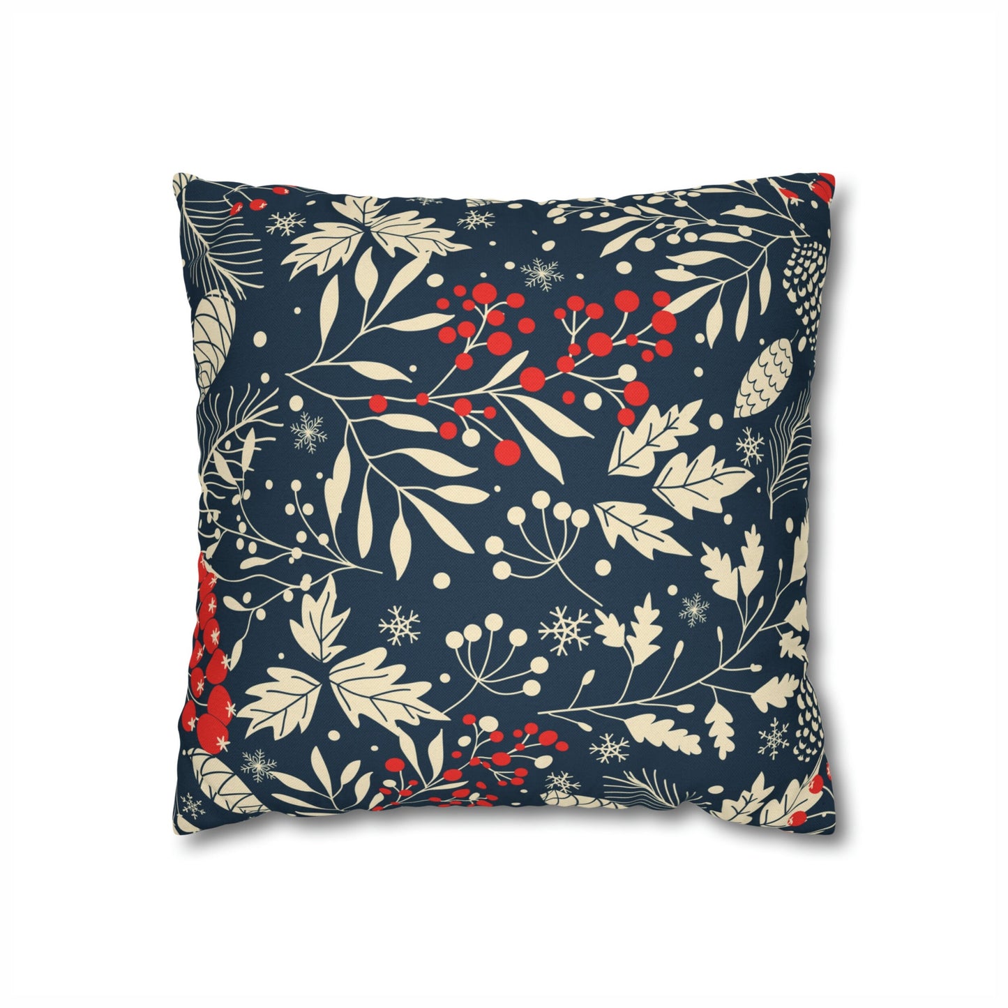 Navy blue pillow with cream pinecones, leaves, snowflakes, and red berries botanical print