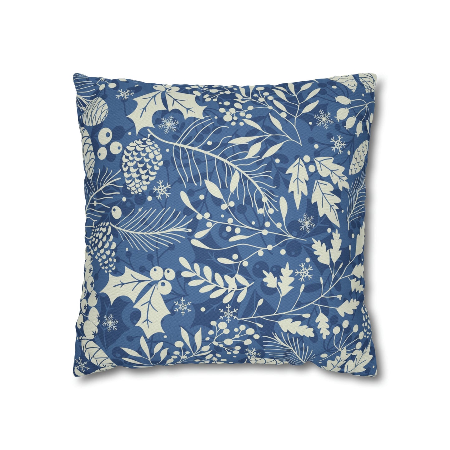 Light blue pillow with cream pinecones, leaves, and snowflakes botanical holiday print