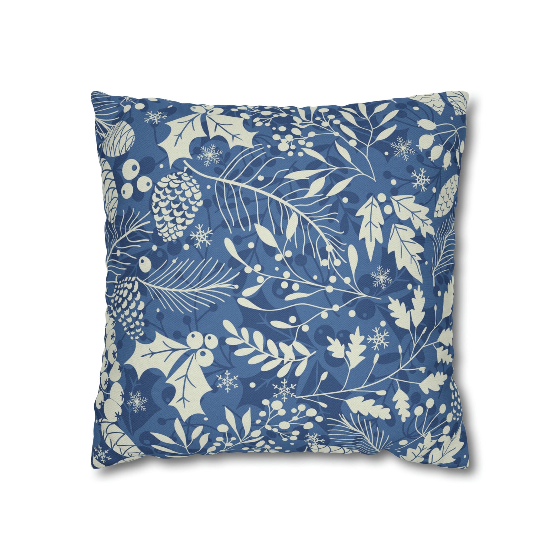 Light blue pillow with cream pinecones, leaves, and snowflakes botanical holiday print